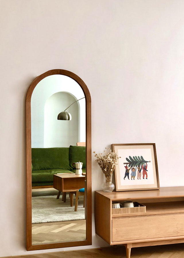 Apli Solid Cherry Wood Full-Length Mirror, hung on the wall.