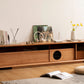 The Filos Solid Cherry Wood TV Console can be used with or without legs.