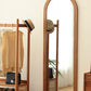 Arcus Solid Cherry Wood Full-Length Mirror, hung on wall