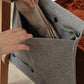 The wooden clothes rack comes with a handy felt pack.